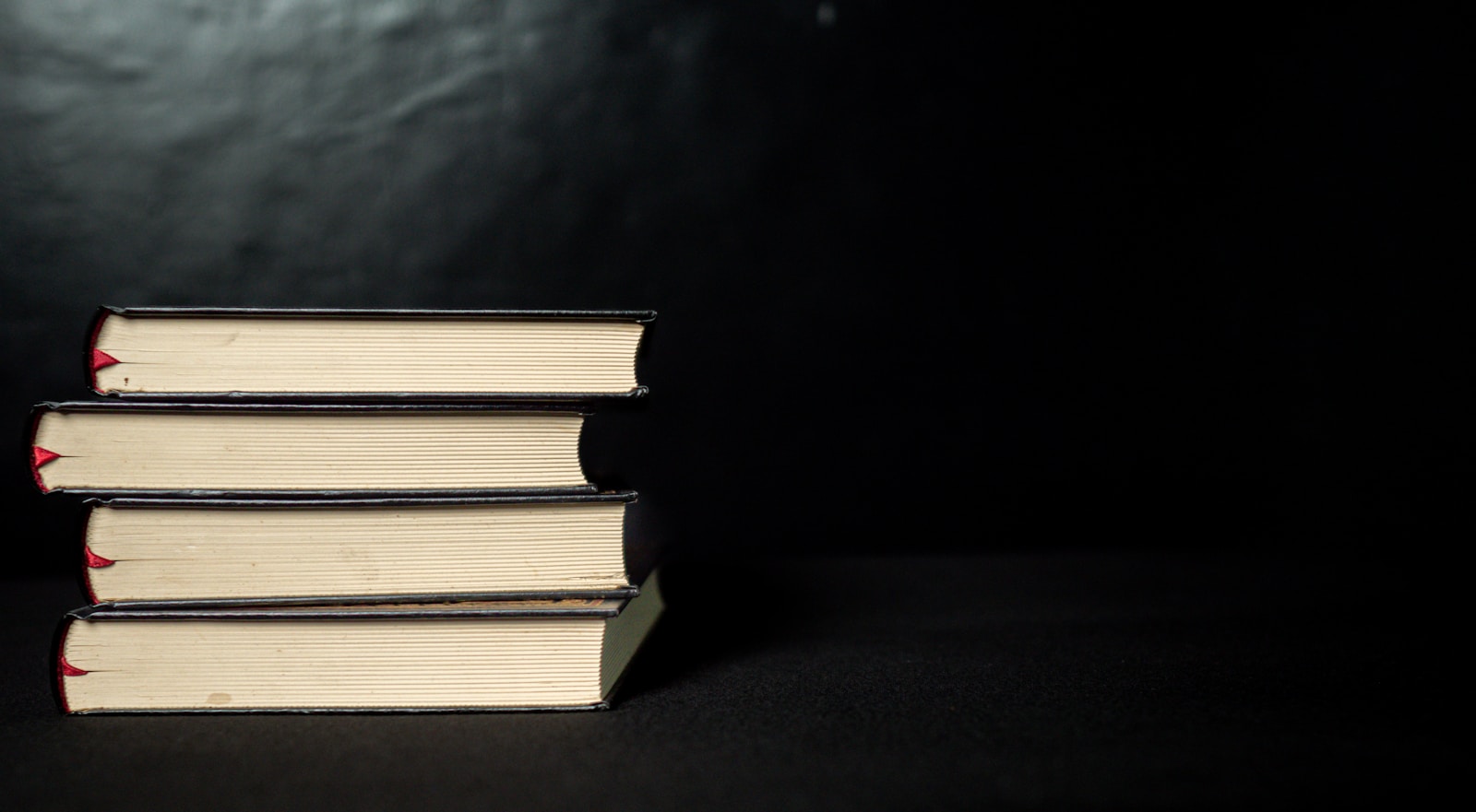 a stack of three books sitting on top of each other