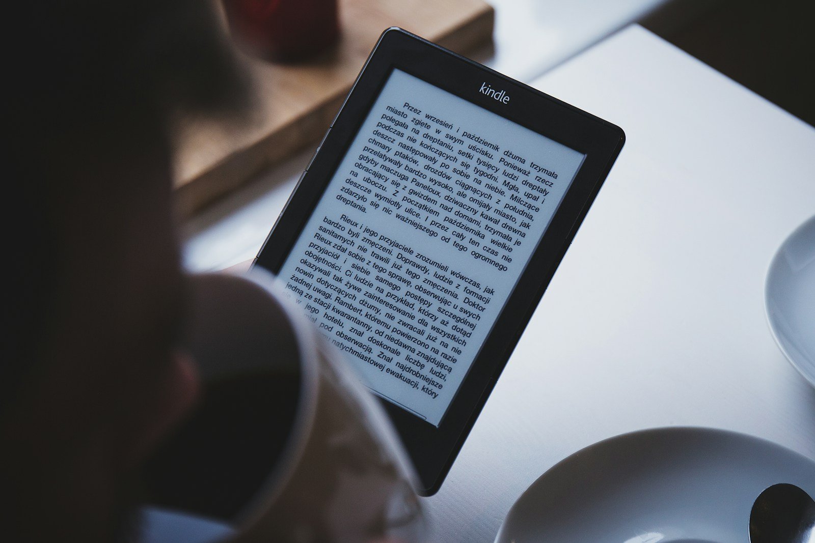 turned on black Amazon Kindle e-book reader